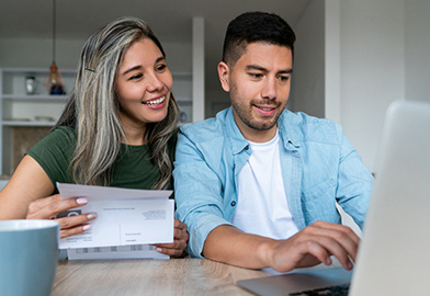 Couple happily going over finances