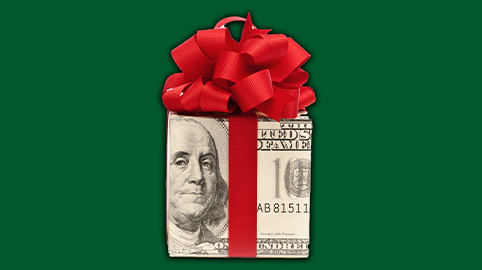 Cash wrapped up as a present in bow