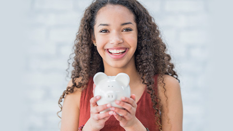 Woman holding piggybank