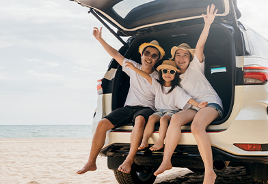 Happy family in a car on vacation
